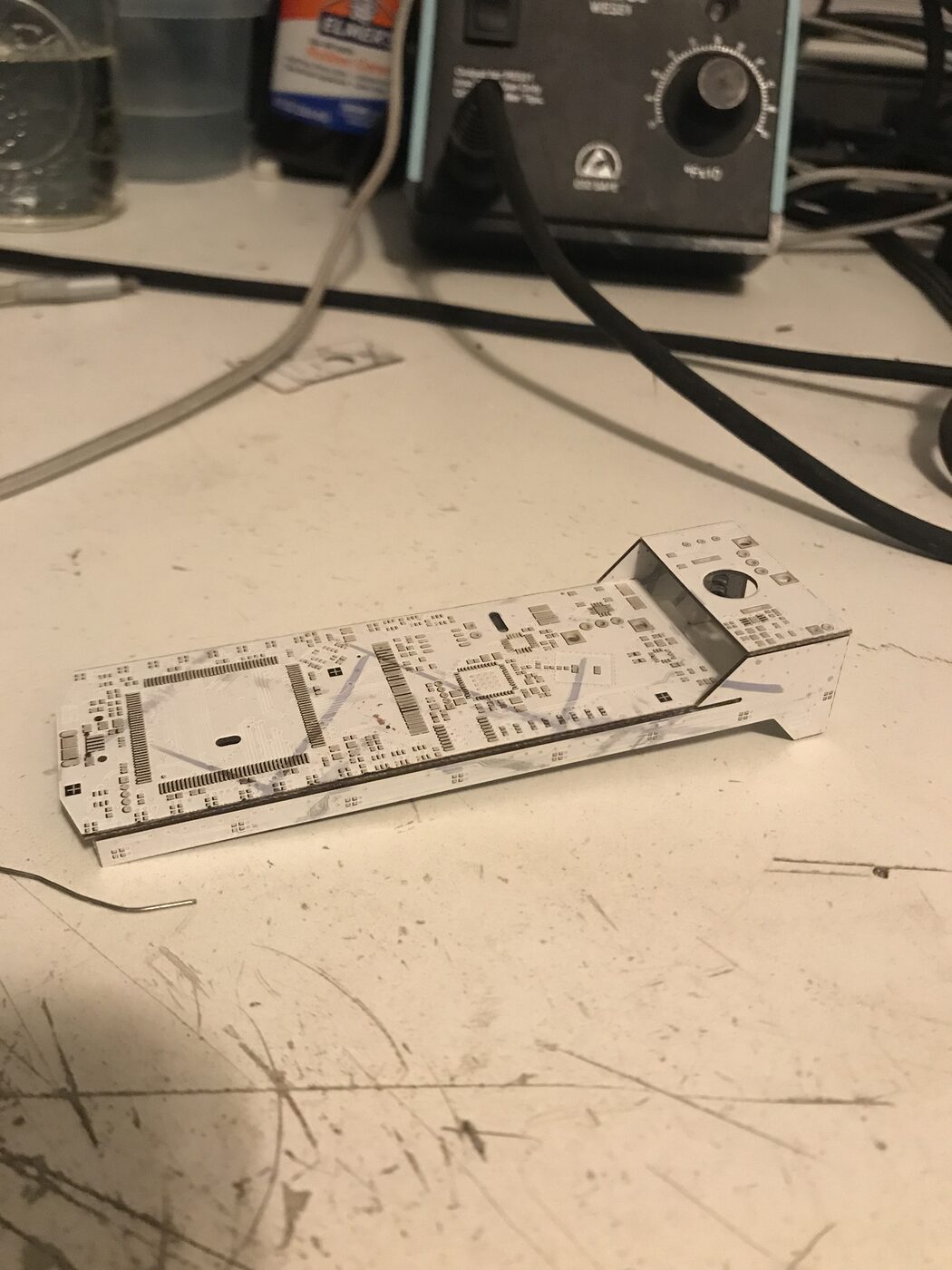 Badge circuit board partly folded, showing it forms the car chassis