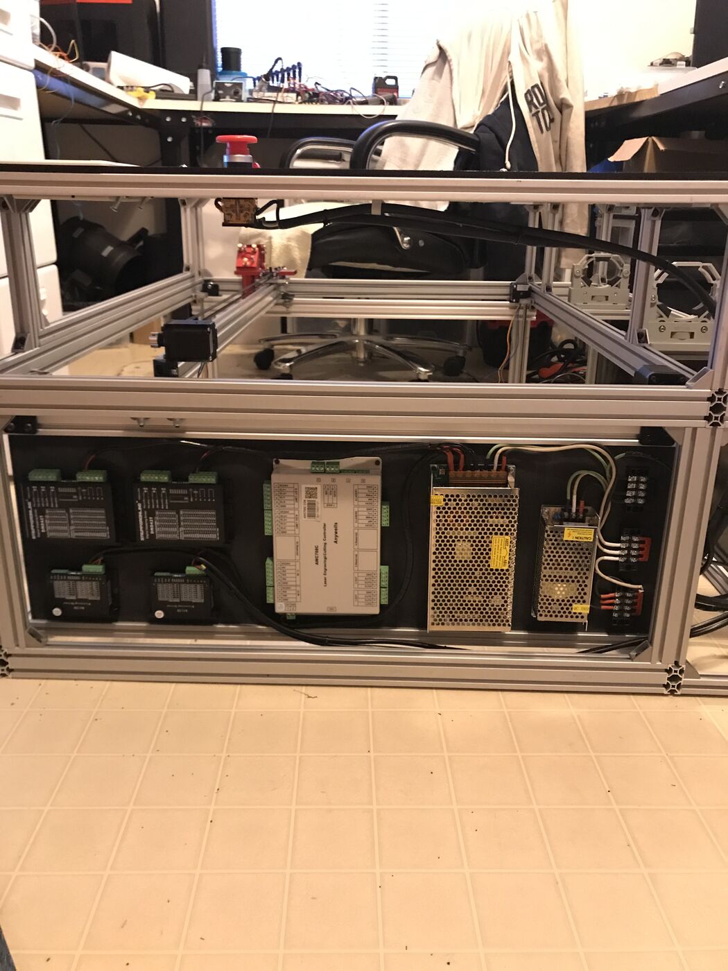 Electronics bay showing four stepper drivers, a controller board, two power supplies and terminal blocks